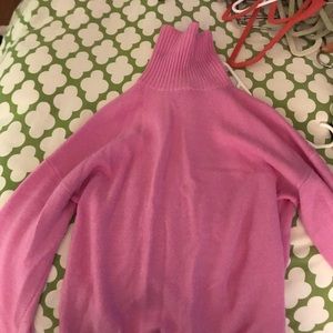 Bright pink turtleneck sweater